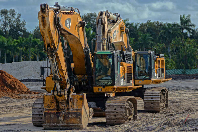 Caterpillar and John Deere Heavy Construction Equipment in a Davie Field under a cloudy sky. A drive-by opportunity I turned around for. Part of my New Years' Resolution not to take it for granted that tomorrow will be another day to stop and capture