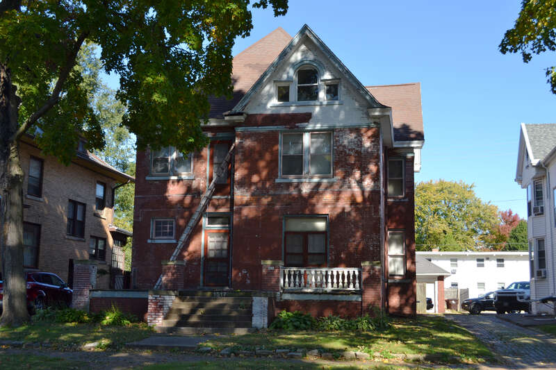 Annette Smith Clemenceau Residence, 1517 W. Barker Ave., Peoria, Illinois.  A metal ladder extends from the front porch to near an obsolete door on the second floor.