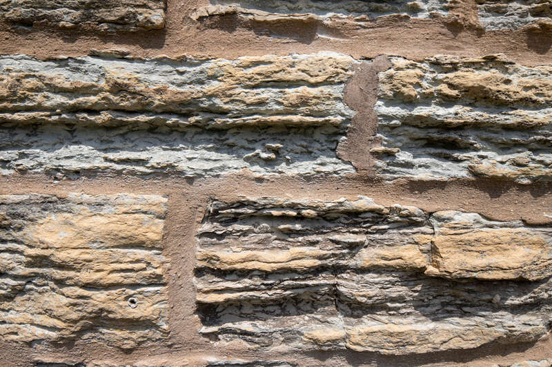 Limestone detail, Water tower, Ellwood House, DeKalb, Illinois. &quot;On the west (rear) of the Ellwood House, the circular limestone water tower is about 50 feet (15.2 m) tall and has a diameter of 18 feet (5.5 m). The tower has windows occurring at