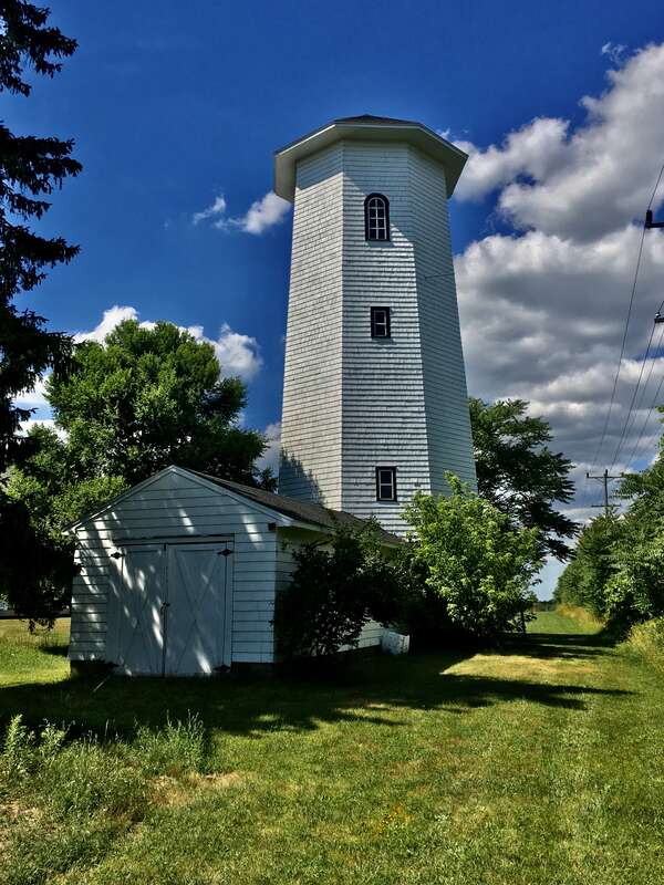 The Goodyear Water Tower, east side of Old Tower Lane between Raine Drive and Northill Drive, Amherst, New York, July 2020. The only known octagonal water tower in Erie County, the wood-frame structure dates to about 1920, stands 65 feet in height,