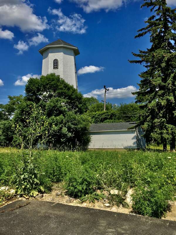 The Goodyear Water Tower, east side of Old Tower Lane between Raine Drive and Northill Drive, Amherst, New York, July 2020. The only known octagonal water tower in Erie County, the wood-frame structure dates to about 1920, stands 65 feet in height,