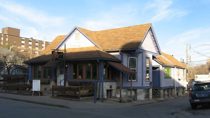 Front of the house located at 116 N. Grant Street (now Cafe Djongo) in Bloomington, Indiana, United States.  Built in 1890, it is part of the locally-designated Old Library Historic District.