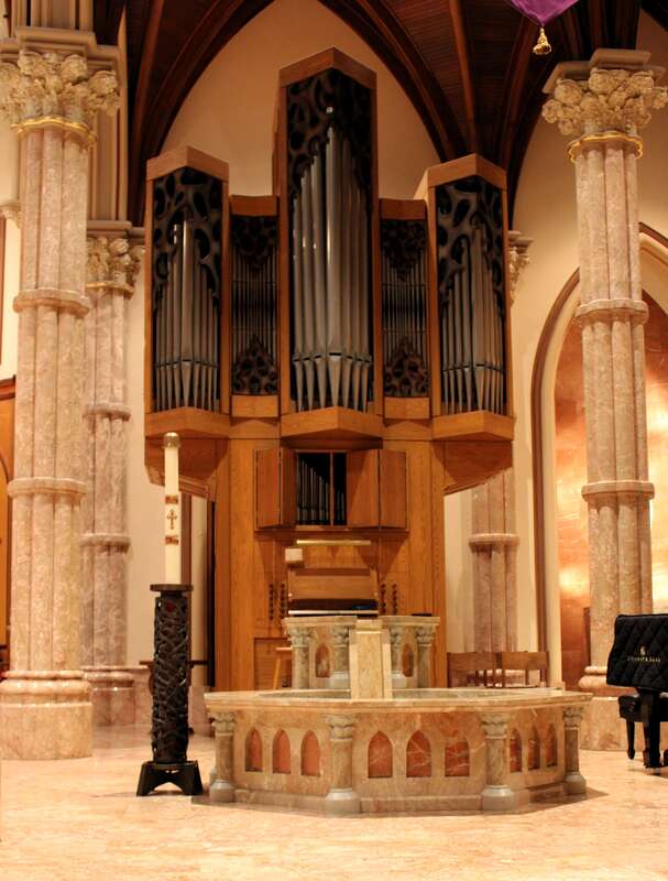 The baptismal font and chancel organ in Holy Name Cathedral (Chicago, Illinois