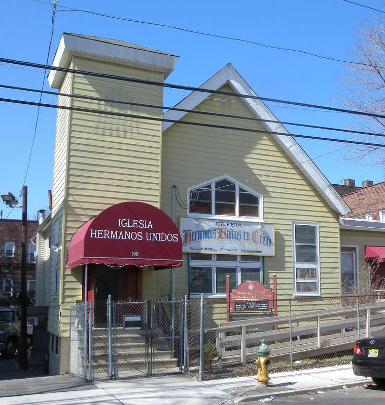 Looking northwest at Iglesia Hermanos Unidos (United Brethren Church) 190 Highland Avenue in the North Ward on a sunny midday.