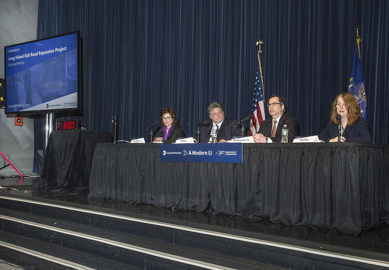 LIRR hearing officers listen during the Long Island Rail Road's community meetings to allow members of the public to learn more about the project and provide their input on an 82-page “Draft Scoping Document” released earlier this month. This meeting