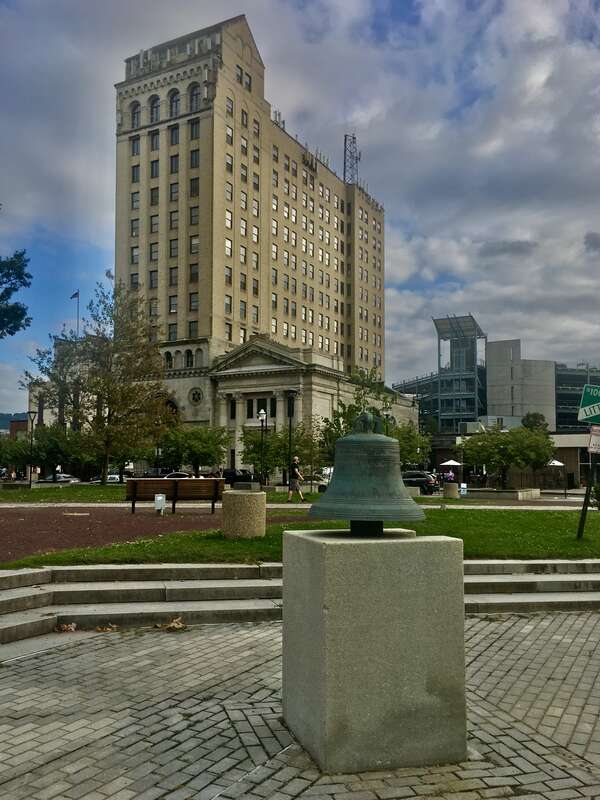 The Luzerne National Bank Building (left; built 1928; the tallest building in the city at 177 feet in height) and the First National Bank Building (center; built 1906) as seen from the west side of Public Square, Wilkes-Barre, Pennsylvania, September