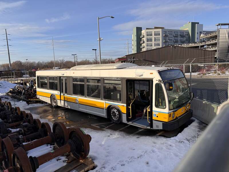 An incomplete shell of a Novabus LFS bus stored at MBTA's Everett Shops. HR Ross industries intended to build these into magnetic induction battery buses, but they were never completed.