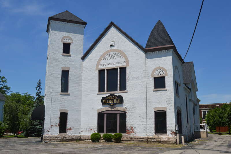 Front and eastern side of the former Mentor Village Hall, located at 8383 Mentor Avenue (U.S. Route 20) in Mentor, Ohio, United States.  Built in 1888, it is listed on the National Register of Historic Places.