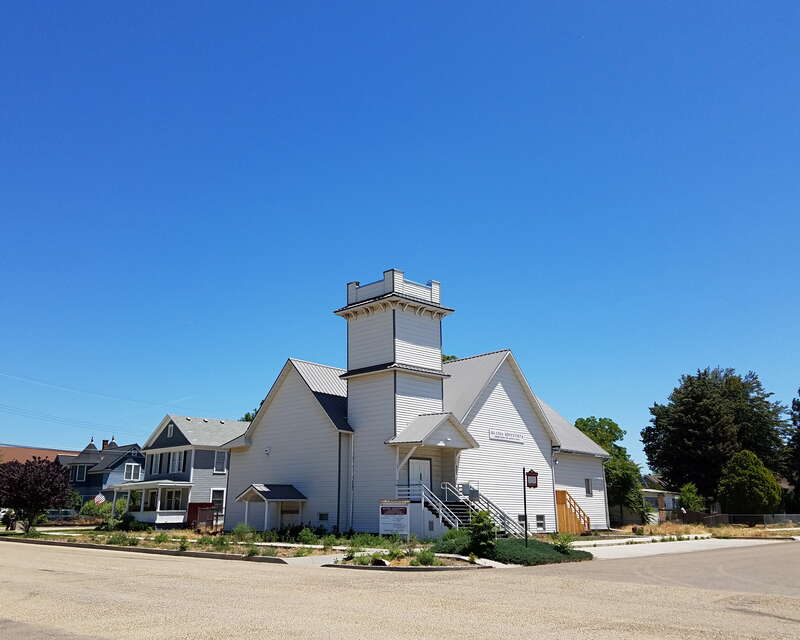 Corner of Albany Street and N. 9th Avenue, three sites in the North Caldwell Historic District, Caldwell, Idaho, from right to left: Presbyterian Church (1890), Presbyterian parsonage (1897), and Johnson House, aka Baker House (1890).