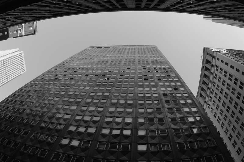 Downtown Pittsburgh PA.  Faced with aluminum panels and designed with windows that rotate outward.  Fisheye perspective, B&amp;amp;W image.