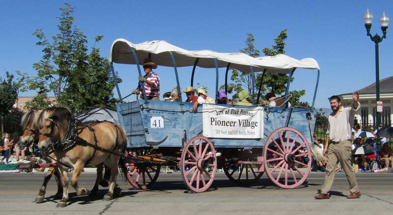 Sons of Utah Pioneers' Pioneer Village wagon in the Freedom Festival Grand Parade.