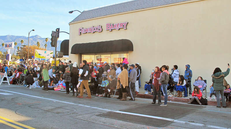 People on Colorado Boulevard, waiting for the Rose Parade to pass through.