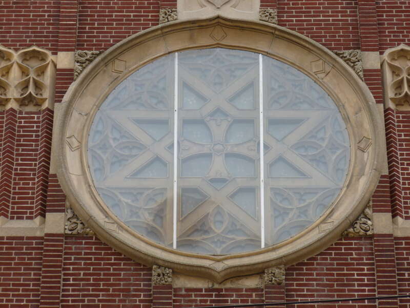 The rose window at the main entrance of Holy Rosary Church, located on the corner of Union Street and Essex Street in Lawrence, Massachusetts.