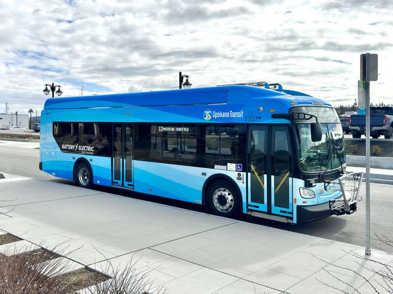 Spokane Transit Authority New Flyer XE35 battery-electric bus. Full right exterior with blue wave livery. March 13,  2024.