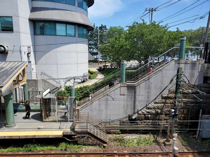 Stairs to Shirley Avenue from the outbound platform at Revere Beach station in July 2021