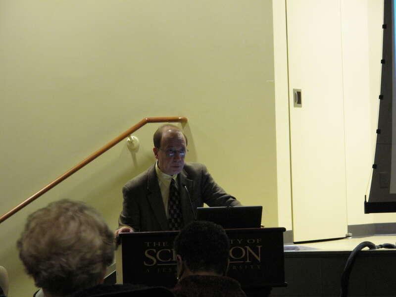 Library Dean Charles Kratz welcomes attendees to the Lincoln symposium