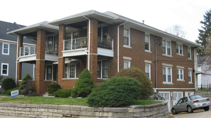 Front and eastern side of the apartment building located at 111 E. Tenth Street in Bloomington, Indiana, United States.  Built in 1928, it is part of the locally-designated Cottage Grove Historic District.