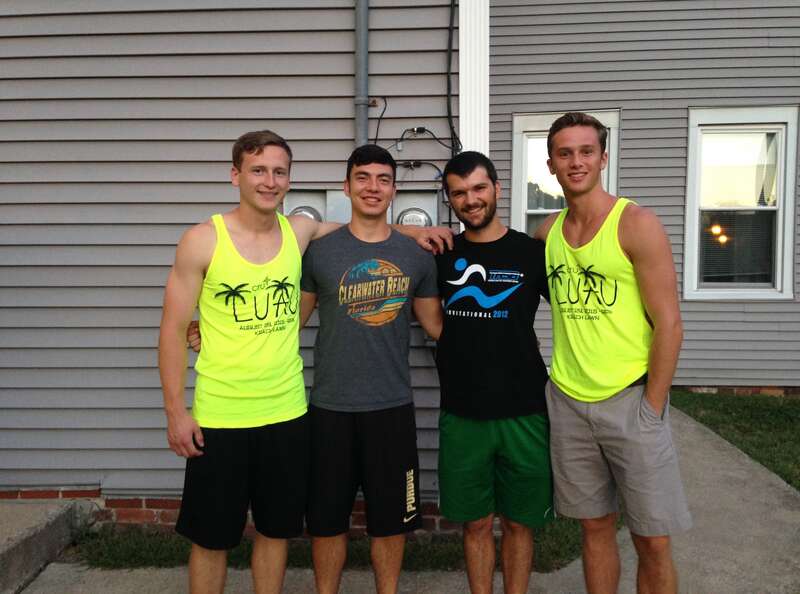 Benjamin Claywell, Gregg Ray, Matthew Mills, and Daniel Grimm enjoying the back yard of the Jesse Andrew House during a late summer evening.