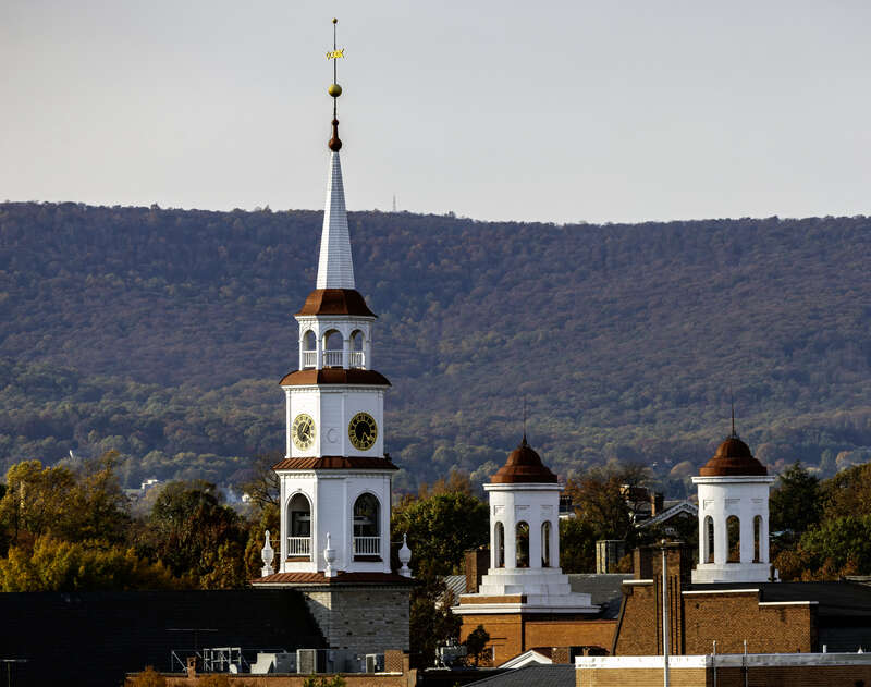 The spire of Trinity Chapel and the cupolas of Evangelical Reformed Church, with Catoctin Mountain behind, Frederick, Maryland, USA