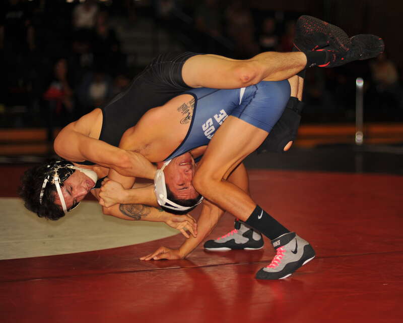 Sergio Sanchez applies leg scissors and a half nelson as he hangs off Mike Perez and let's gravity take its toll.  Perez was trying to get up but his balance is precarious and Sanchez seems to be gaining the advantage as Perez starts to tip