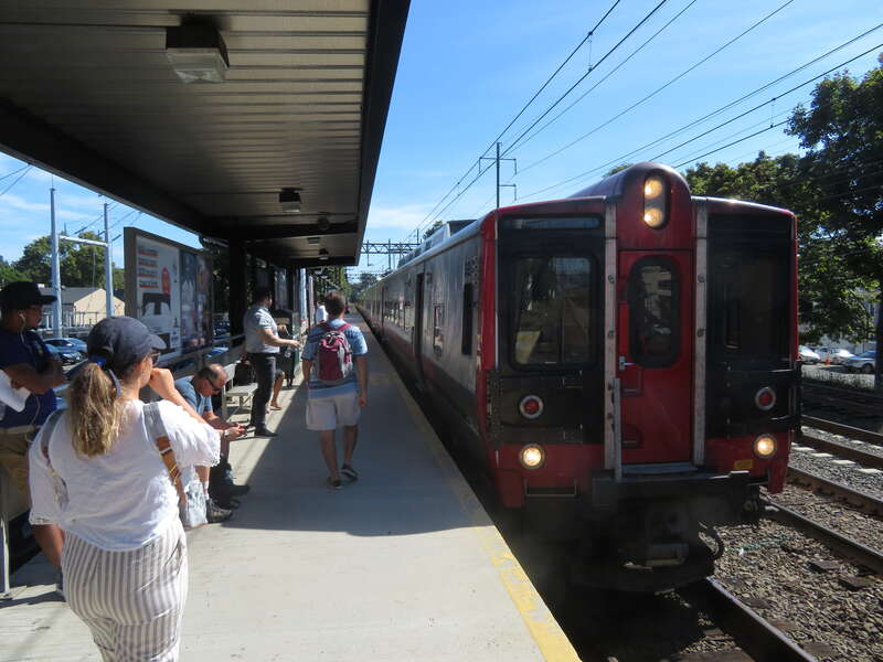 A westbound train arrives at East Norwalk station in September 2018