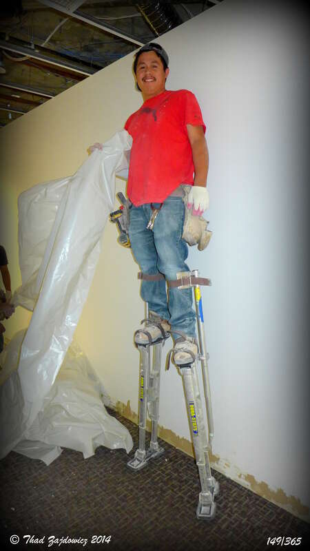 Lots of renovation going on in our offices - it will be most worthwhile when finished, just have to get through the noise and dust. This worker on these incredible stilts was very willing to let me photograph him as my photo of the day - a great