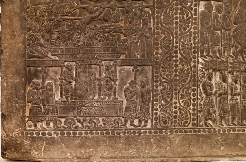 Back panel of a funerary bed showing the deceased drinking from a bull headed rhyton and entertained by fancers and musicians under a grape arbor. Sogdian and Zorastrian imagery. China, Northern Qi, 550 AD - 577 AD, From the Museum of Fine Arts,