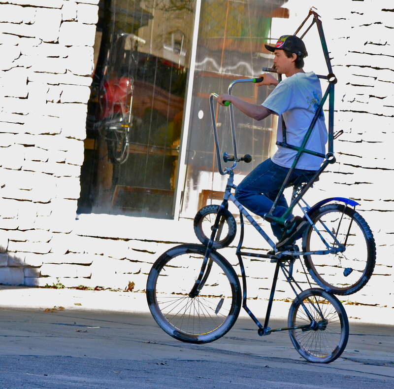 I caught this guy taking his contraption out for a spin one sunny afternoon in Gainesville Florida outside of &quot;Spin Cycle,&quot; bike shop. 

The exposure on the back wall is really hot but other than than that not bad. Looks like it's a combo of two