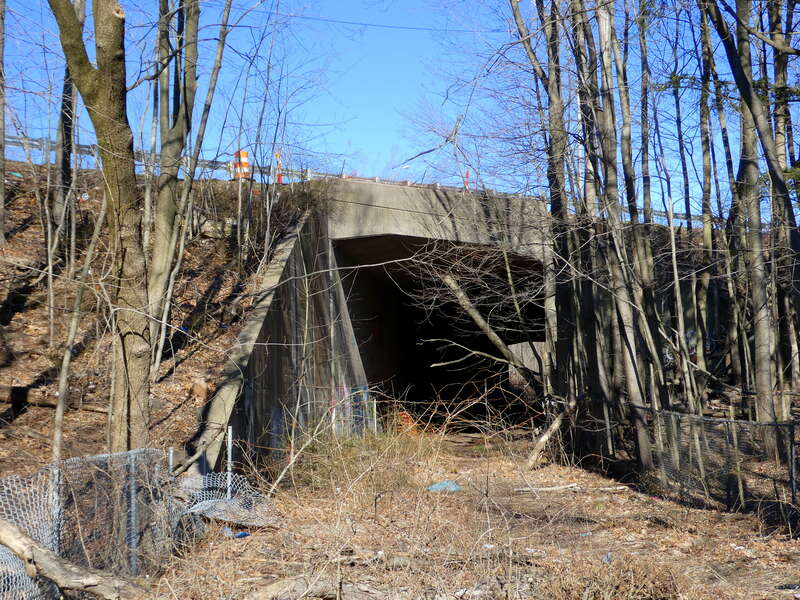 Abandoned underpass that formerly carried the Center Street Branch of the Meriden, Waterbury and Connecticut River Railroad under I-691 in Meriden, seen in March 2023