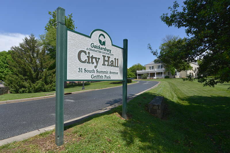 A sign at the entrance to Gaithersburg Citty Hall and Griffith Park, with the city hall in the background. 31 South Summit Avenue, Gaithersburg, MD 20877.