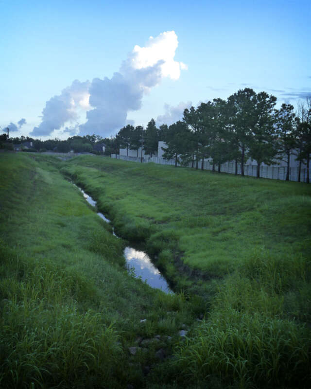Cloud reflected in the water in a drainage ditch taken on the way to work