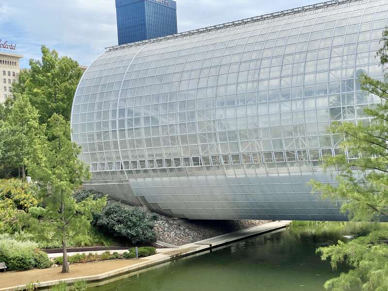 Built in 1983-1985, this Modern building was designed by Conklin and Rossant as part of the construction of the Myriad Botanical Gardens, which began construction in 1971.  The building consists of a large cylinder that is 224 feet (68 meters) long