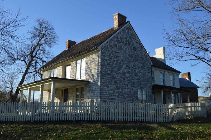 Front and southeastern side of the Daniel Harrison House, located on Main Street in northern Dayton, Virginia, United States.  Built in 1748, it is listed on the National Register of Historic Places.