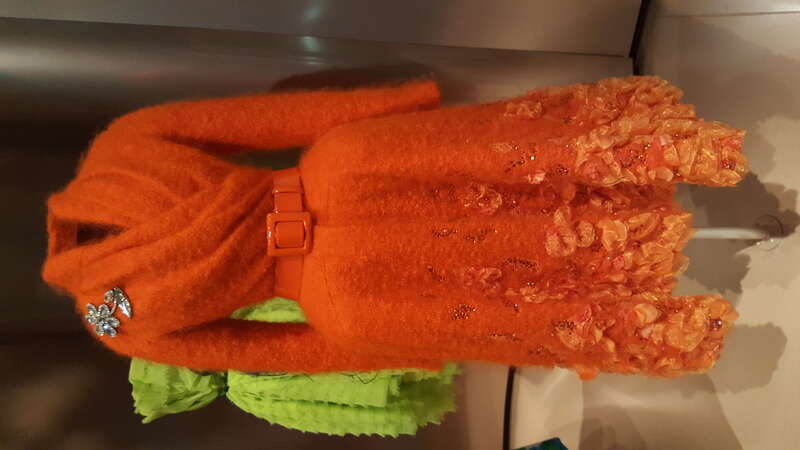 Embroidered orange bouclette coat by John Galliano for Christian Dior (Fall-Winter 2009) on display at the Denver Art Museum