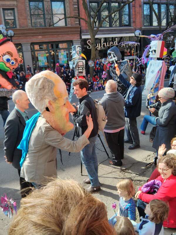 A giant puppet head of City of Ann Arbor mayor John Hieftje accompanies the mayor at the annual Festifools parade in 2013.