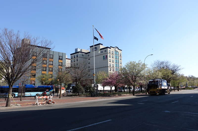 Looking at the Alfred J. Kennedy Memorial Flagstaff within the Daniel Carter Beard Mall section of Flushing Greens, in the median of Northern Boulevard at Main Street in Downtown Flushing, Queens. The &quot;Greens&quot;, a promenade in the median of Northern