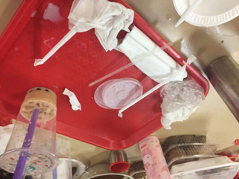 Red food court tray with waste