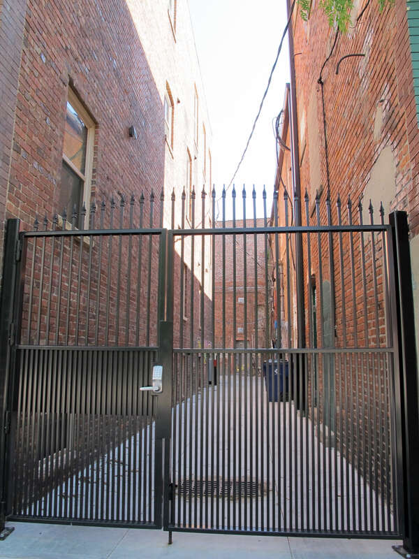 Photo of a gated alley in Lincoln, Nebraska.  This alley is the first east of N. 14th on the south side of &quot;P&quot; Streets.  Photo is taken looking south from the south sidewalk on &quot;P&quot;.