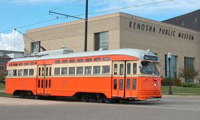 Kenosha streetcar 4615 (ex-Toronto 4615), painted in the colors of the former Johnstown Traction Company (of Johnstown, Pennsylvania) and displaying a historic Johnstown destination (Ferndale) on its rollsign.  It is eastbound on 56th Street at  1st