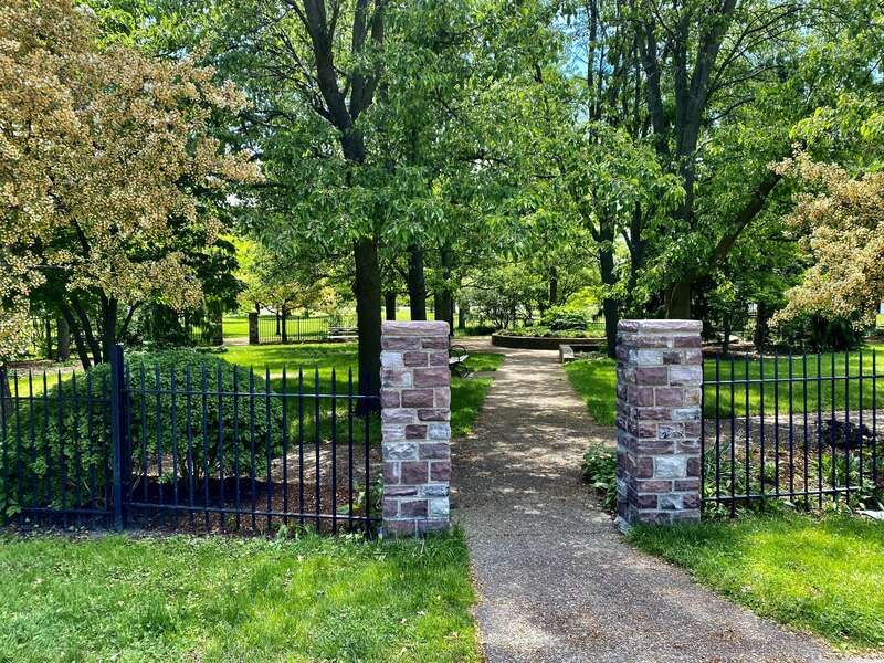 As seen in May 2021: the entrance gate to the &quot;cottage garden&quot; at Martin Luther King, Jr. Park. Tucked away inconspicuously behind the Science Museum, facing the parking lot and the park ring road, the garden was once a much grander entity: its
