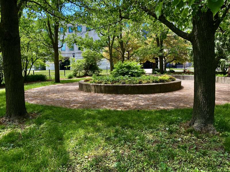 As seen in May 2021: the entrance gate to the &quot;cottage garden&quot; at Martin Luther King, Jr. Park. Tucked away inconspicuously behind the Science Museum, facing the parking lot and the park ring road, the garden was once a much grander entity: its