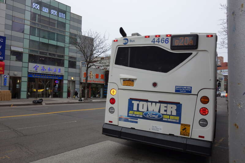 The back of a Orion VII NG bus in Jamaica-bound Q20 service, at Main Street and Northern Boulevard in Downtown Flushing, Queens. Note that this bus has an &quot;MTA Bus&quot; sticker, indicating it has recently been transferred from another depot.