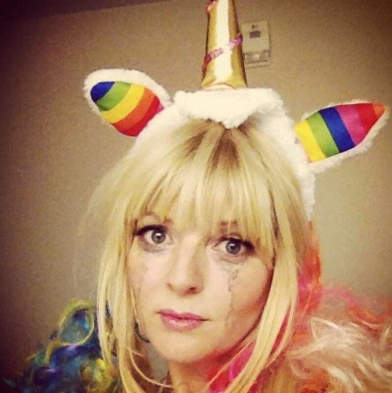 A close-up photograph of comedian/actress Melinda Hill in makeup behind the scenes of the web series Romantic Encounters.