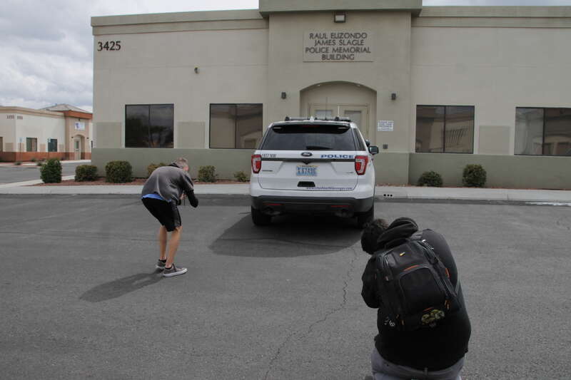 Two photographers taking photos of a 2016 FPIU of the North Las Vegas Police Department at the North Las Vegas Police Officer's Association.