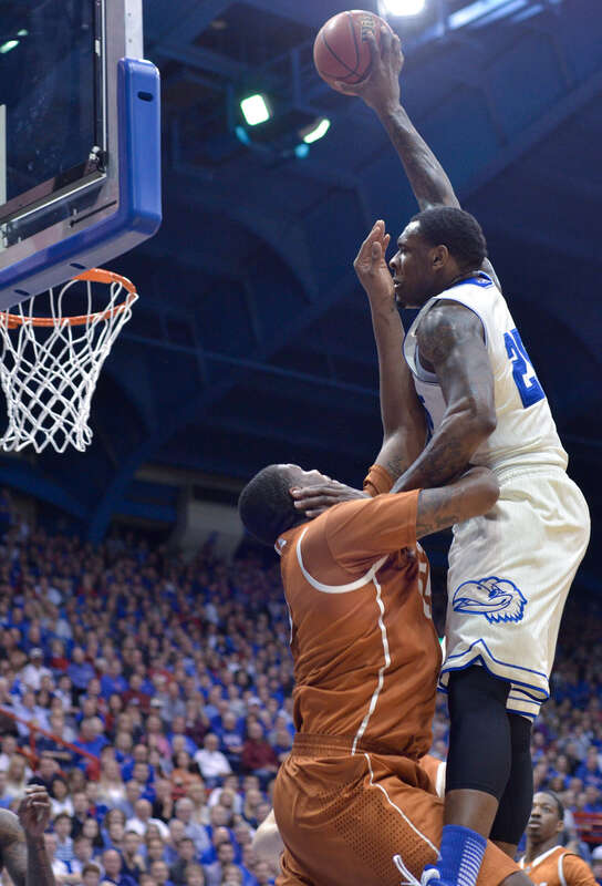 500px provided description: Senior forward Tarik Black posterizes a Texas defender. Black scored eight points off of field goals in the Feb.22 Kansas defeat of Texas 85-54. [#lawrence ,#texas ,#college ,#kansas ,#basketball ,#ncaa ,#allen fieldhouse