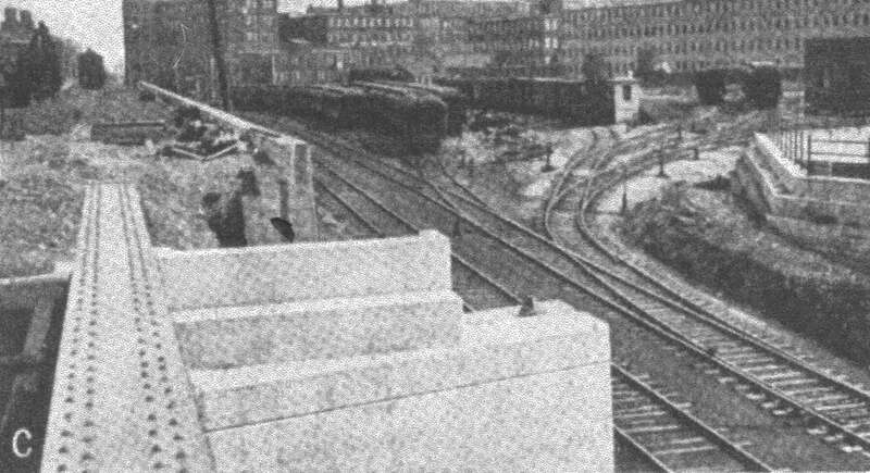 View east of Pleasant Street during grade crossing elimination in Lynn in the 1910s. Elevation of the northern pair of tracks is at left; the retaining wall at center will be enclosed within the embankment. At right is the Market Street freight yard.