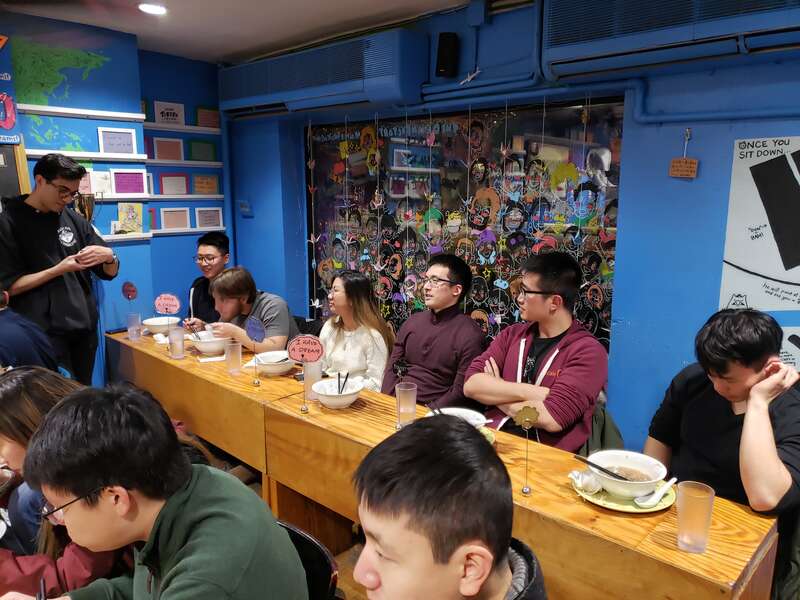 The dining room at Yume Wo Katare, a ramen bar in Cambridge, Massachusetts. Diners here are seen sharing their dreams with one another after finishing their meal, led by restaurant staff.