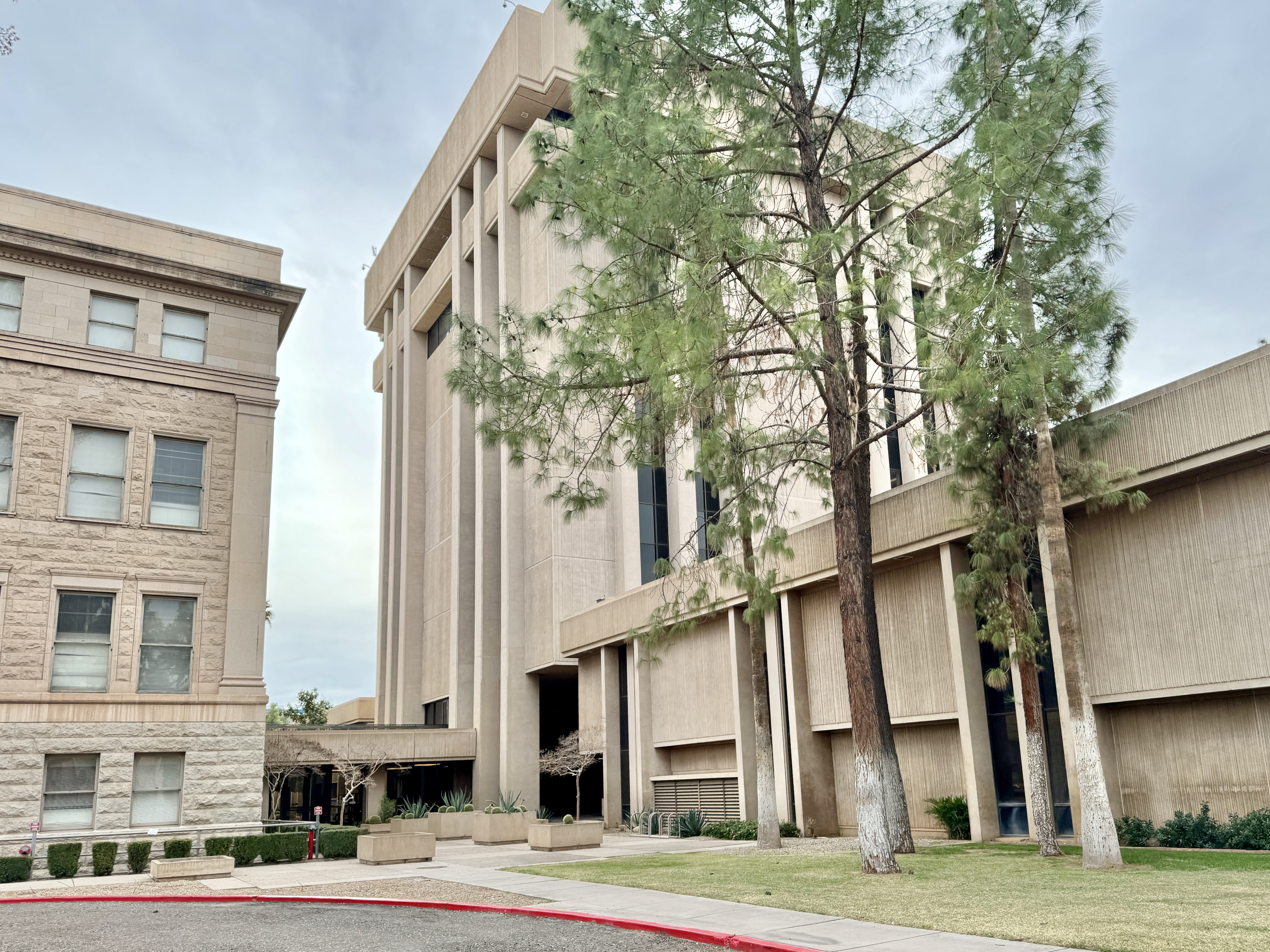 Built in 1974, this office tower, designed by Varney, Sexton and Sydnor in the Brutalist style, was constructed to the rear (west) of the original Arizona State Capitol.  The building stands 9 stories and 110 feet (33 meters) tall, and is clad in