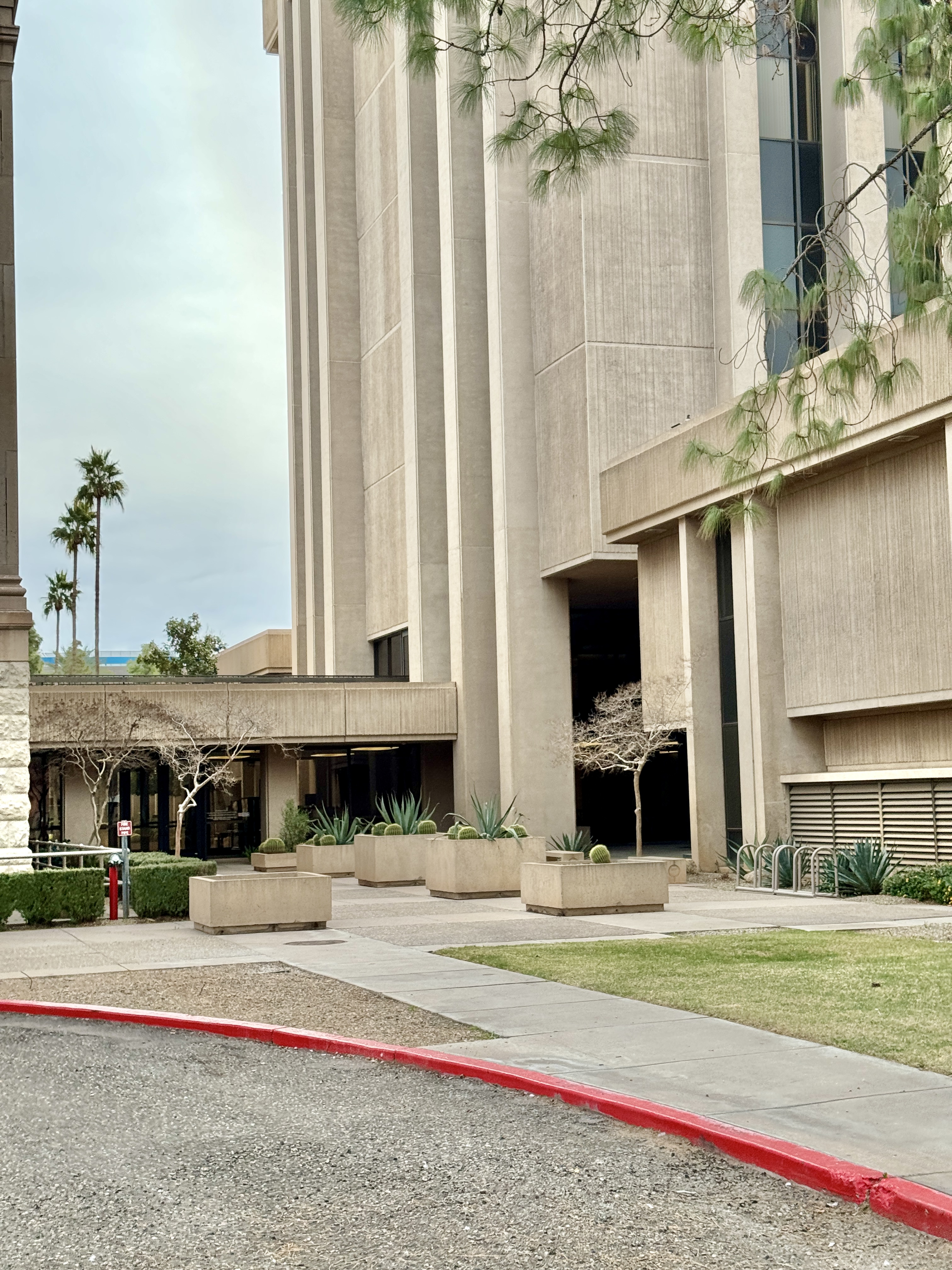 Built in 1974, this office tower, designed by Varney, Sexton and Sydnor in the Brutalist style, was constructed to the rear (west) of the original Arizona State Capitol.  The building stands 9 stories and 110 feet (33 meters) tall, and is clad in