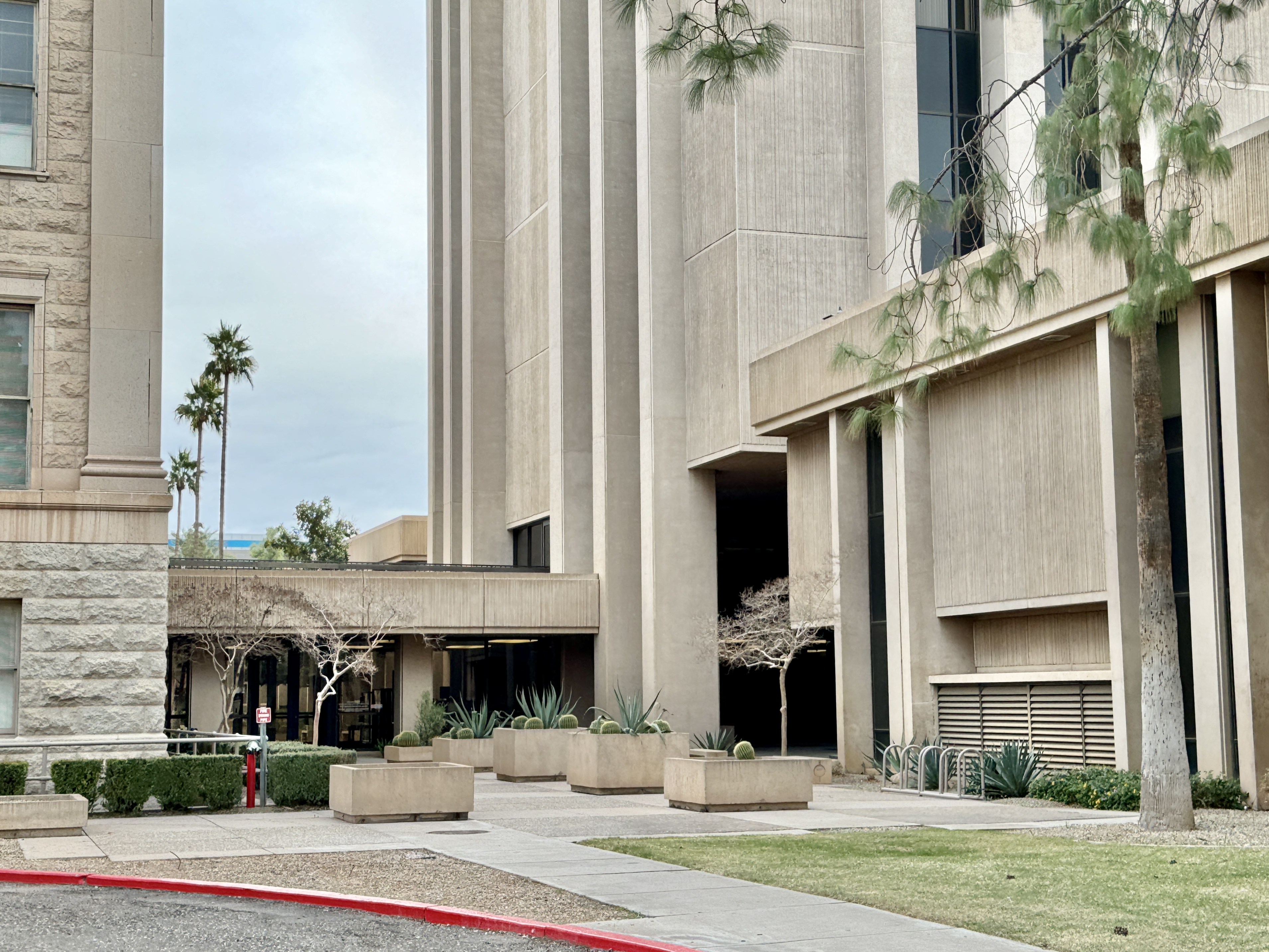 Built in 1974, this office tower, designed by Varney, Sexton and Sydnor in the Brutalist style, was constructed to the rear (west) of the original Arizona State Capitol.  The building stands 9 stories and 110 feet (33 meters) tall, and is clad in
